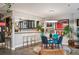 Dining area near kitchen featuring art, a modern light fixture, and a view of the open layout at 930 Acoma St # 106, Denver, CO 80204