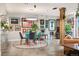 Bright dining room featuring modern lighting, art-filled walls, and an open floor plan at 930 Acoma St # 106, Denver, CO 80204