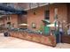 Brick buildings featuring patios, planters and walkways in an urban setting at 930 Acoma St # 106, Denver, CO 80204