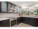 Modern kitchen featuring sleek cabinetry, stainless steel appliances, and stylish tile backsplash at 930 Acoma St # 106, Denver, CO 80204