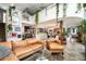 Expansive living area with open concept, gallery wall, kitchen access, and staircase to a loft at 930 Acoma St # 106, Denver, CO 80204