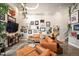 Spacious living room offering plenty of natural light, stylish decor, plants and comfortable seating at 930 Acoma St # 106, Denver, CO 80204