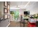 Contemporary office space with modern computer setup and balcony views at 930 Acoma St # 106, Denver, CO 80204