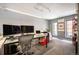 Bright office space featuring modern desk setup, multiple monitors, and natural light at 930 Acoma St # 106, Denver, CO 80204