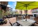 Inviting outdoor patio with dining and seating areas, perfect for relaxation and entertaining at 930 Acoma St # 106, Denver, CO 80204