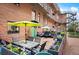 Inviting outdoor patio with dining and seating areas, perfect for relaxation and entertaining at 930 Acoma St # 106, Denver, CO 80204