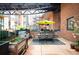 Outdoor patio with dining table, barbecue, and potted plants in a relaxing environment at 930 Acoma St # 106, Denver, CO 80204