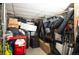 Organized storage room with shelving, containers, and a variety of storage equipment at 930 Acoma St # 106, Denver, CO 80204