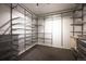 Organized walk-in closet featuring metal shelving and drawers for efficient storage solutions at 930 Acoma St # 106, Denver, CO 80204