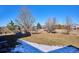 Large backyard with a swing set and picnic table, providing plenty of space for outdoor activities at 5107 Appleton Way, Castle Rock, CO 80104