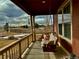 Relaxing front porch with a swing and view of the backyard at 5107 Appleton Way, Castle Rock, CO 80104