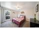 Cozy bedroom with a queen bed, ceiling fan, and large window at 7251 S Xenia Cir # F, Centennial, CO 80112