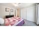 Bright bedroom with double bed and sliding door closet at 7251 S Xenia Cir # F, Centennial, CO 80112