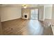 Living room with hardwood floors and sliding doors to patio at 7251 S Xenia Cir # F, Centennial, CO 80112