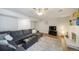 Living room with L-shaped sofa, fireplace and wood floors at 7251 S Xenia Cir # F, Centennial, CO 80112