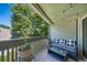 Private patio with seating area, string lights, and treetop views at 7251 S Xenia Cir # F, Centennial, CO 80112