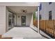 Back porch featuring neutral siding, stained wood accents and a gravel back yard at 2515 N Gaylord St, Denver, CO 80205