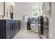 Modern bathroom featuring double sink vanity, standalone tub and marble accent wall at 2515 N Gaylord St, Denver, CO 80205