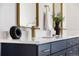 Close up on double sink vanity with modern fixtures and countertop decor at 2515 N Gaylord St, Denver, CO 80205