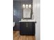 Bathroom features a modern vanity with sleek black cabinetry and gold hardware at 2515 N Gaylord St, Denver, CO 80205