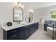 Modern bathroom featuring double sink vanity, standalone tub and modern mirrors at 2515 N Gaylord St, Denver, CO 80205