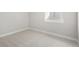 Clean, neutral bedroom with carpet flooring and a bright window at 2515 N Gaylord St, Denver, CO 80205