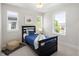 Cozy bedroom with twin bed and three bright windows at 2515 N Gaylord St, Denver, CO 80205