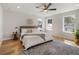 Bedroom features neutral tones, lots of natural light from the three windows, and wood floors at 2515 N Gaylord St, Denver, CO 80205