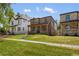 Charming two-story brick home with well-manicured lawn, enhancing curb appeal at 2515 N Gaylord St, Denver, CO 80205