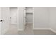 Bright hallway with carpeted floors, white walls, doors, and access to closets at 2515 N Gaylord St, Denver, CO 80205