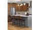 Modern kitchen featuring stainless steel appliances, a large island, and stylish pendant lighting at 2515 N Gaylord St, Denver, CO 80205