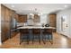 Open concept kitchen with island seating, stainless appliances, and sleek modern finishes at 2515 N Gaylord St, Denver, CO 80205
