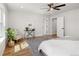 Bright main bedroom with wood floors, ceiling fan, lots of natural light, and an attached bathroom at 2515 N Gaylord St, Denver, CO 80205