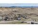 Aerial view of the neighborhood, showcasing the houses nestled within a scenic and open landscape at 8182 3Rd Ave, Arvada, CO 80007