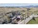 Stunning aerial view showcases the property and surrounding landscape, including the mountains in the distance at 8182 3Rd Ave, Arvada, CO 80007
