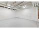 Unfinished basement featuring painted white walls and floors and exposed utilities at 8182 3Rd Ave, Arvada, CO 80007