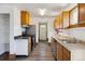 Modern kitchen with updated appliances, sleek countertops, and wooden cabinetry at 8182 3Rd Ave, Arvada, CO 80007