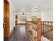 Bright living room featuring wooden floors and stairway to another floor at 8182 3Rd Ave, Arvada, CO 80007