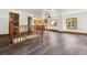 Open-concept living area with natural light, hardwood floors, and staircase at 8182 3Rd Ave, Arvada, CO 80007