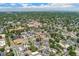 Neighborhood aerial view showcasing the property's location within a tree-lined community at 3657 Pecos St, Denver, CO 80211