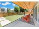 The cozy backyard patio with modern cedar shade covering offers great space for entertaining at 3657 Pecos St, Denver, CO 80211