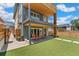 A backyard offers a seamless transition with patio seating and well-maintained artificial turf at 3657 Pecos St, Denver, CO 80211
