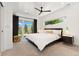 Bright and airy bedroom with a large window, modern ceiling fan, and neutral decor for a relaxing retreat at 3657 Pecos St, Denver, CO 80211