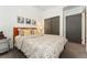 Serene bedroom featuring a plush bed with patterned bedding and neutral decor at 3657 Pecos St, Denver, CO 80211