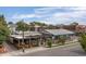 Aerial view of a restaurant featuring a covered outdoor seating area, lush greenery, and unique design at 3657 Pecos St, Denver, CO 80211