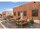 Exterior of Diebolt Brewing Co. featuring brick facade, picnic tables, and string lights at 3657 Pecos St, Denver, CO 80211