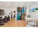 Bright kitchen with island seating, modern appliances, and an adjacent dining nook at 3657 Pecos St, Denver, CO 80211