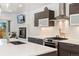 Modern kitchen with stainless steel appliances, white countertops, and ample cabinet space, blending style and functionality at 3657 Pecos St, Denver, CO 80211