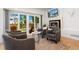 Comfortable living room featuring a modern fireplace and sliding glass doors to yard at 3657 Pecos St, Denver, CO 80211