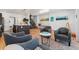 Open-concept living room offering modern decor and seamless flow to the dining area at 3657 Pecos St, Denver, CO 80211